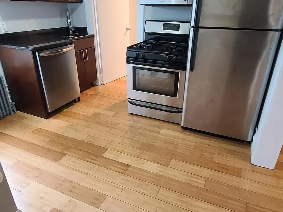 Kitchen with granite counters, stainless steel appliances and dishwasher