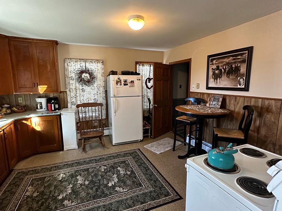 View of the kitchen while the current tenant is occupied. Furnishings not included. Washer & Dryer hookups in kitchen. New Refridgerator and Stove will be supplied.