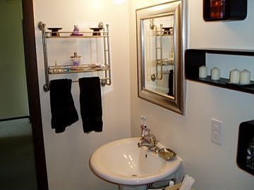 FB- new toilet, sink, and tile- shelving will stay