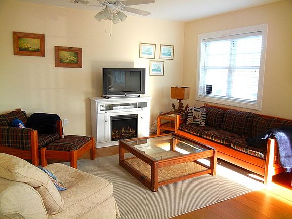 Living room with TV and fireplace.