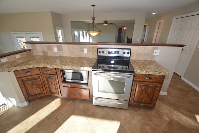 stove looks over living room