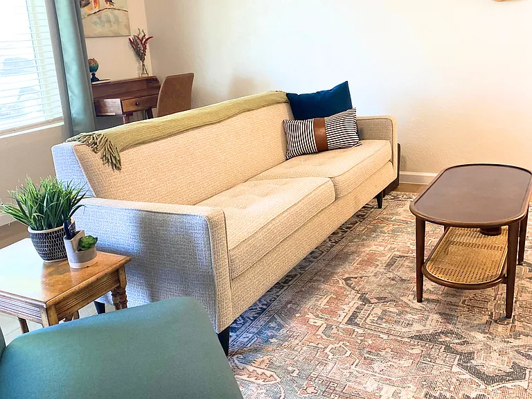 Comfortable living space with coffee tables and extra seating.