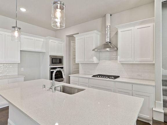 Kitchen in the Cabernet home plan by Trophy Signature Homes - REPRESENTATIVE PHOTO