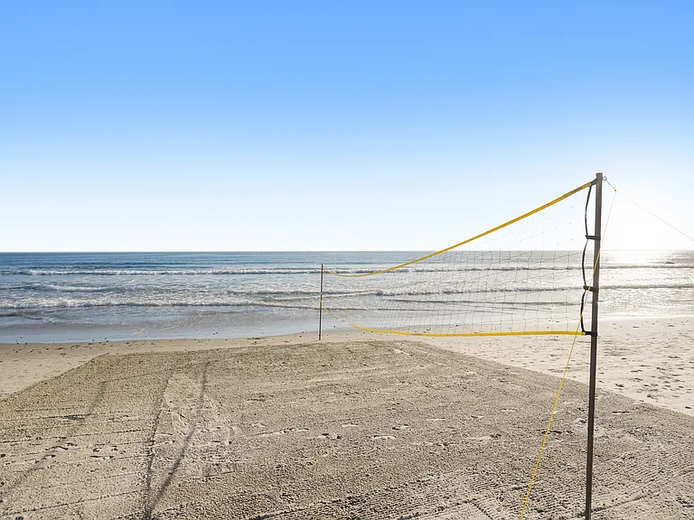 Play under the sun, then cool off in the waves.
