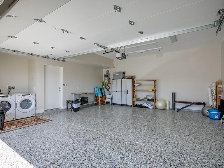 Spacious garage fits two cars.