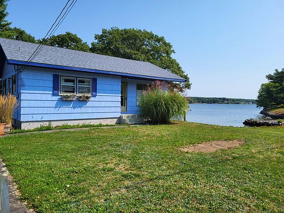 front of cottage with lahave river to the side of the property. Easy access for kayaking and other water sports.