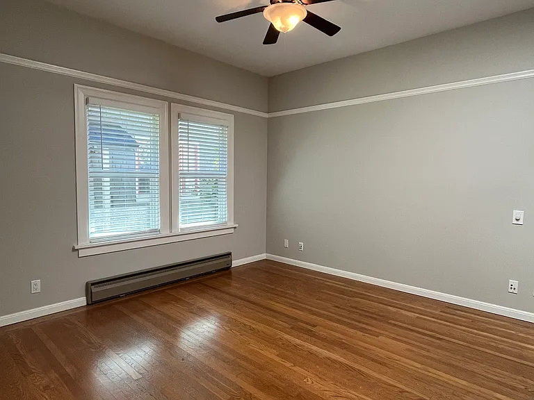 Bedroom 2 with ceiling fan. Skylight provides additional natural light.