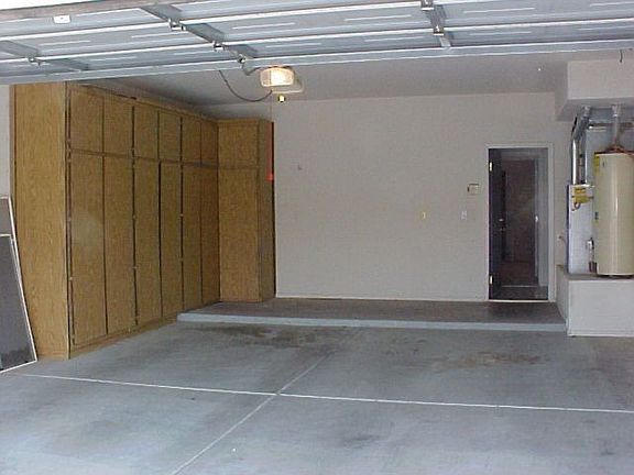 2 car attached garage w/ storage cabinets
