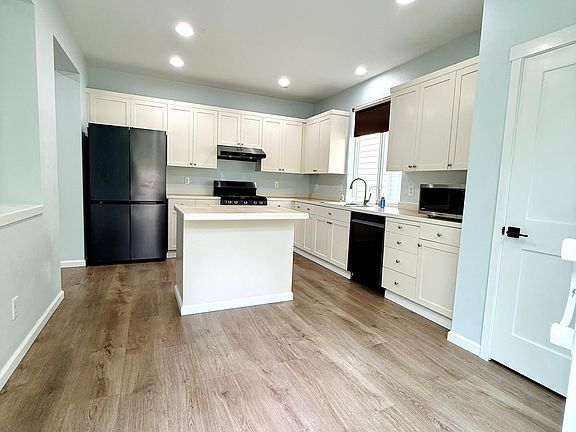 Big Kitchen with updated black stainless appliances