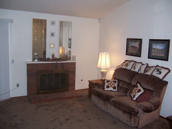 SPACIOUS FAMILY ROOM WITH COZY FIREPLACE.
