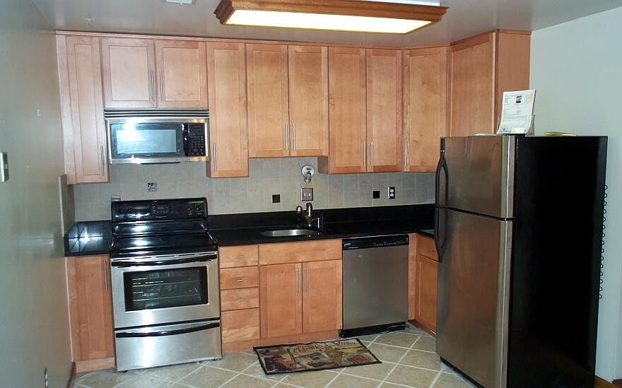 Updated kitchen with granite & stainless appliances
