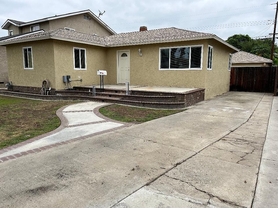 Home front with long side driveway. Can park about 3 cars in the driveway plus street parking