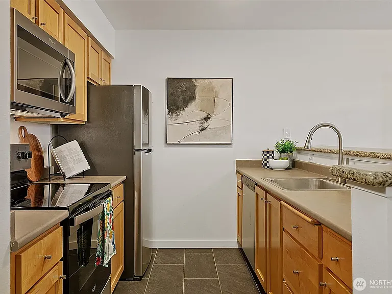Kitchen has all new appliances. Open concept is nice for entertaining.