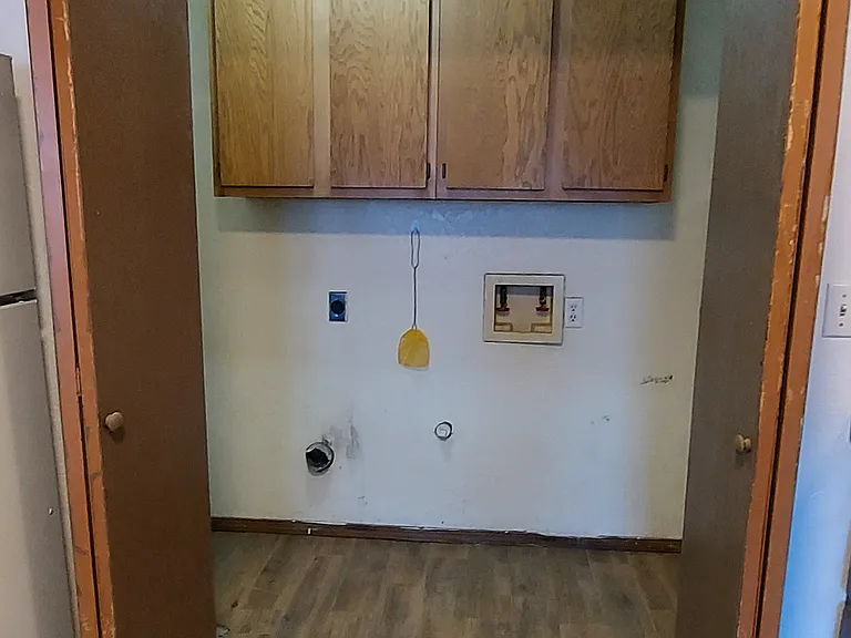 Utility room with washer/dryer hook up and water heater