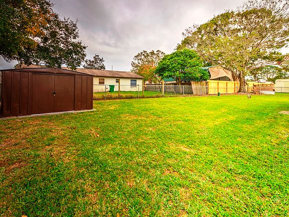 Large fenced back yard with 
