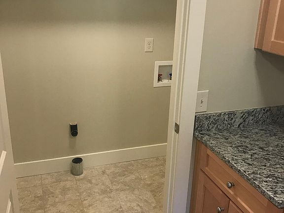 Laundry with new tile floor.