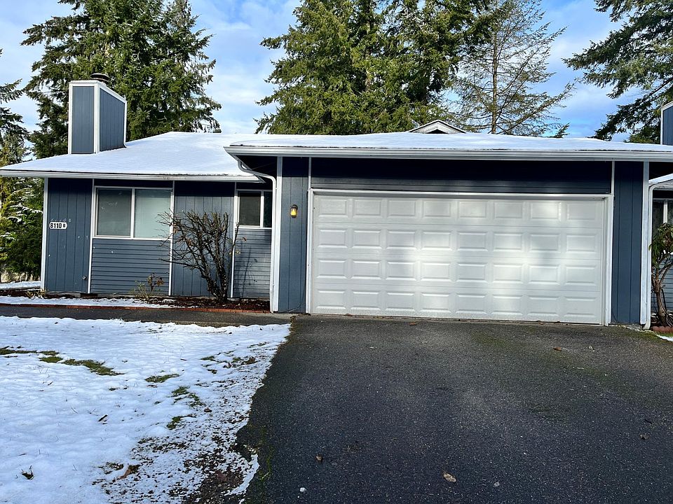 Front of Unit with 2 Car Garage (1 side is a work area with Workbench)