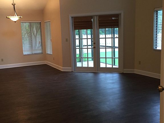 Open concept Living room/dining room. Vaulted ceiling.