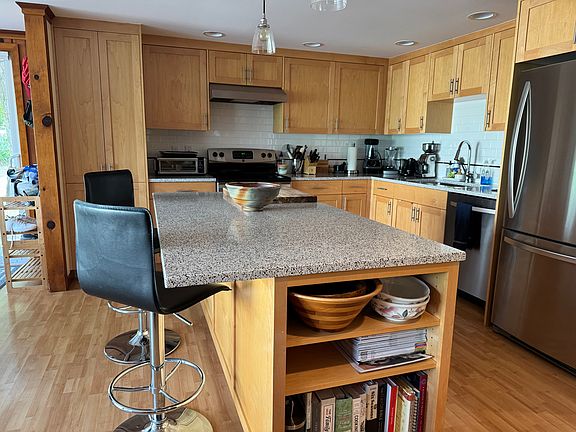 Eat in kitchen with island, plenty of storage and stainless steel applicances.