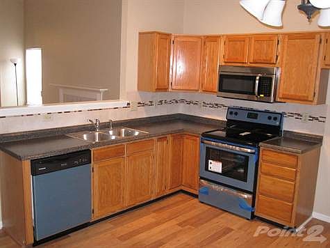 Kitchen with new counter, sink, back splash and appliances
