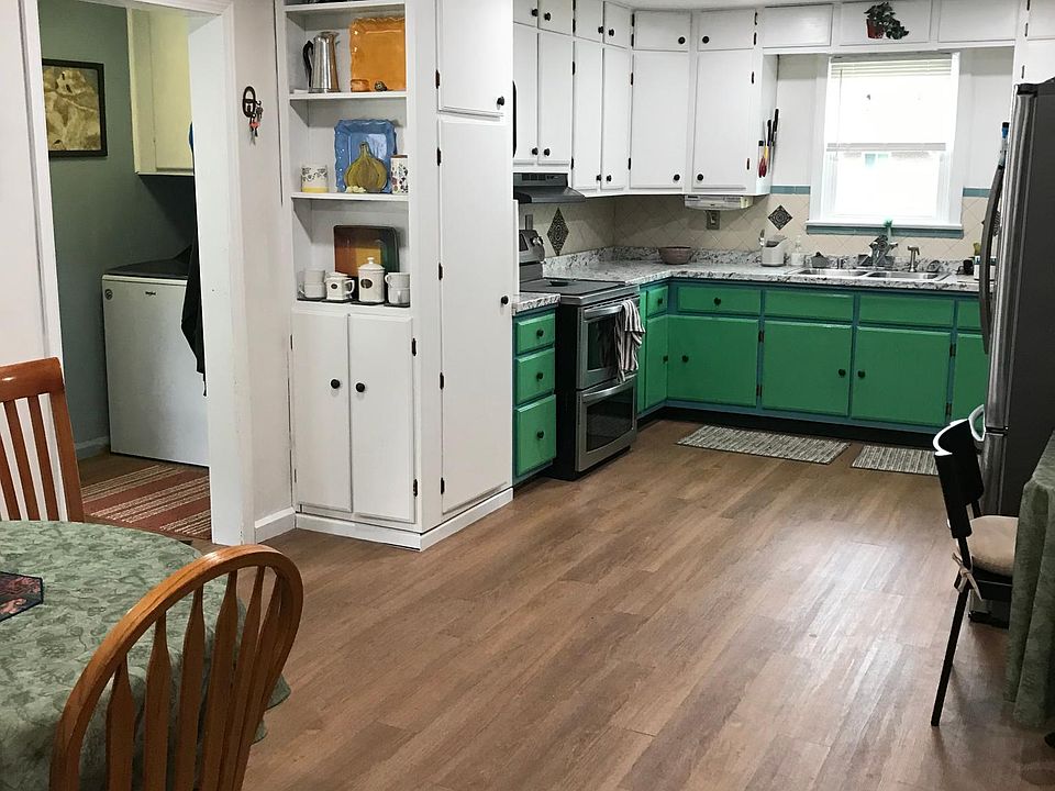 fully furnished kitchen with laundry room to the left