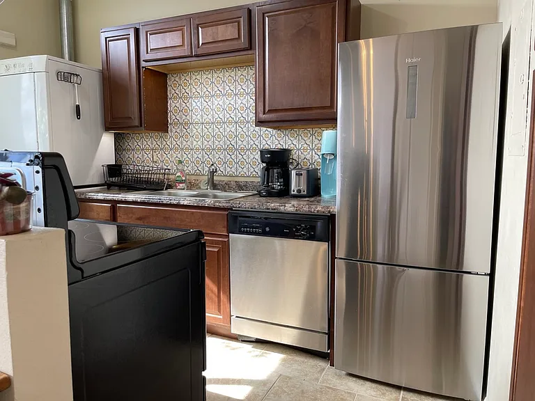Refrigerator with freezer below, and dishwasher