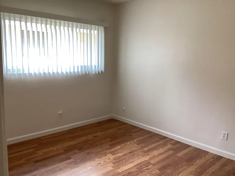 Bedroom with wall-to-wall closets