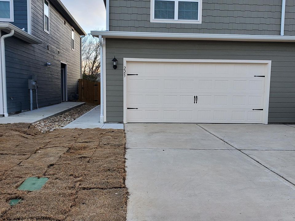 Front with fresh new sod and private driveway for additional parking