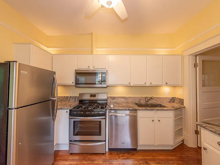 Vented microwave with stove hood, gas stove and dishwasher. Well lit and comfortable eat in kitchen.