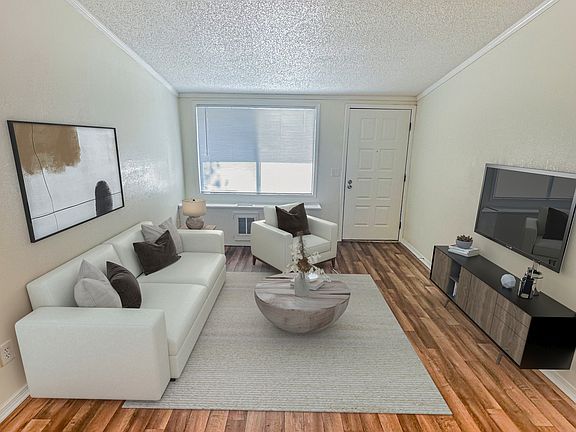 Relax in open-concept living rooms featuring vaulted ceilings that create an airy and expansive feel.