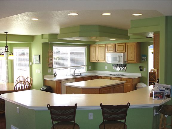 Bright kitchen with white Corian counters