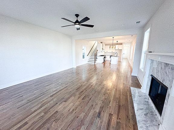 Downstairs open living and dining with fireplace