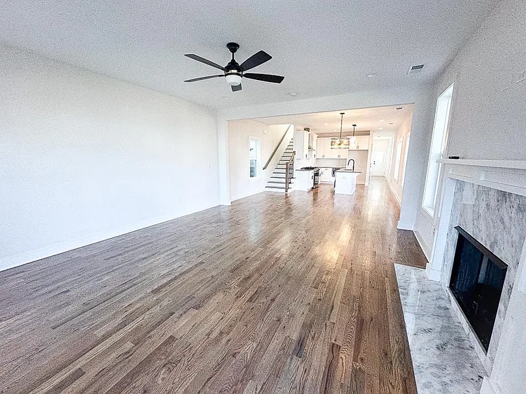 Downstairs open living and dining with fireplace