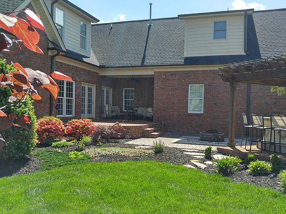 stone patio and pergola