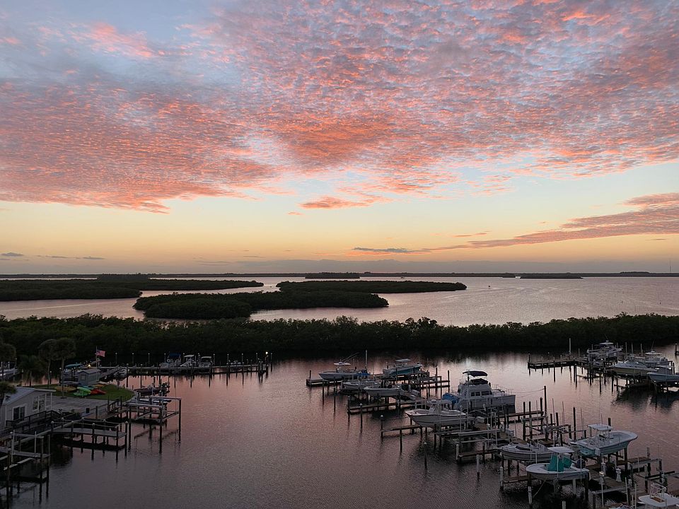 sunset view off balcony of marina and intercoastal