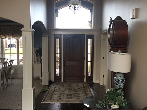 Glam chandelier entry way.
