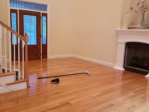 Living room with cathedral ceilings, gas fireplace and ceiling fan