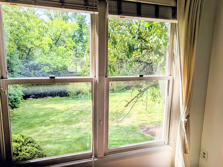 Living room sitting space window, great view of creek and greens