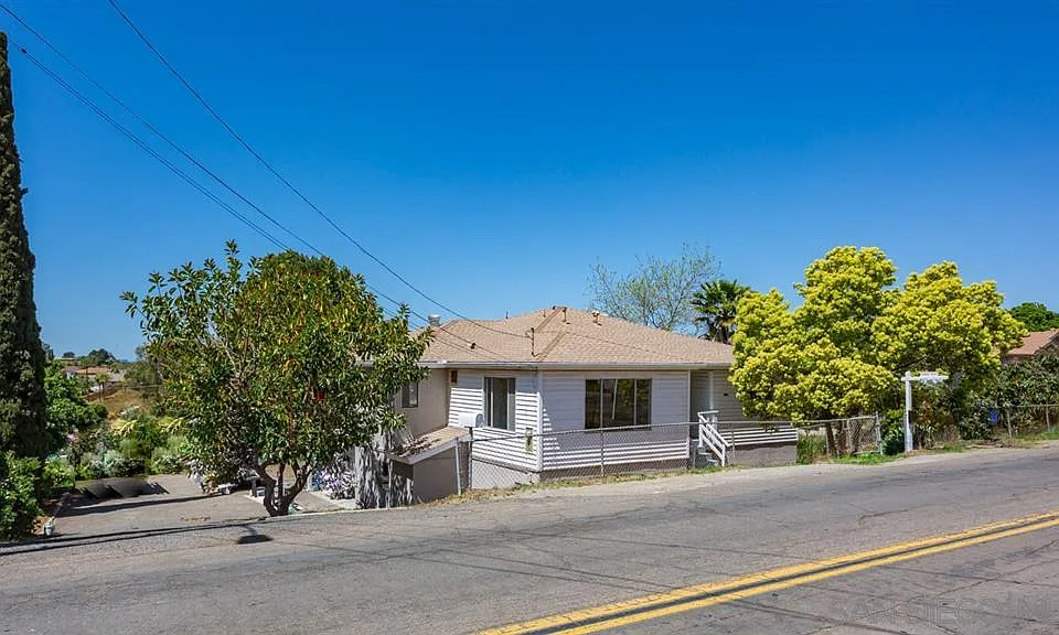 Side Angle Street View of Property - Drive on Left leads to Private Unit B on 1st Floor. The Top 2nd Floor is Unit A.