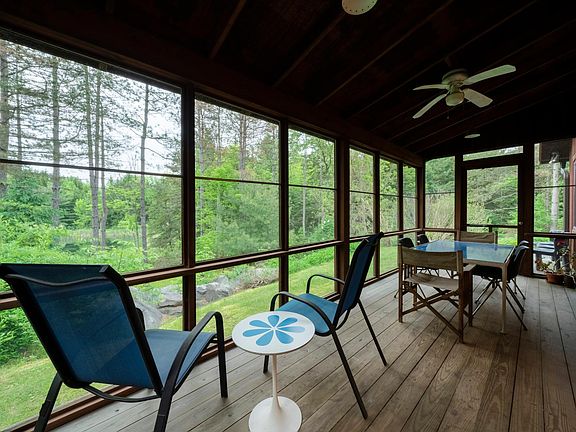 Enclosed porch facing pond