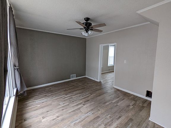 Living room with doorway leading to dining room.