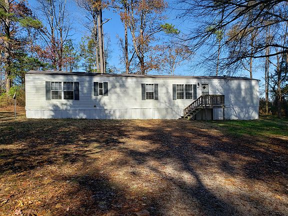 Large front yard with plenty of parking. Backs up to empty lot.