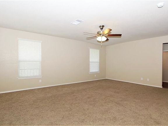 Family room with door to back patio & back yard.