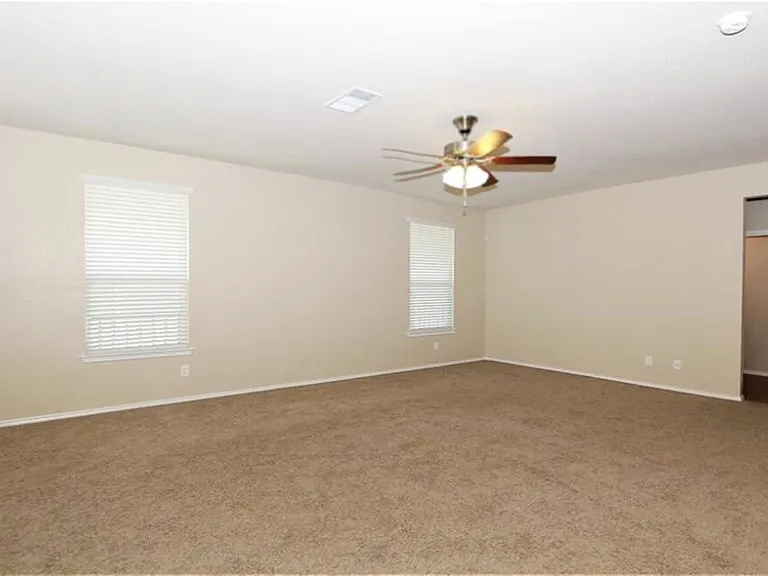 Family room with door to back patio & back yard.