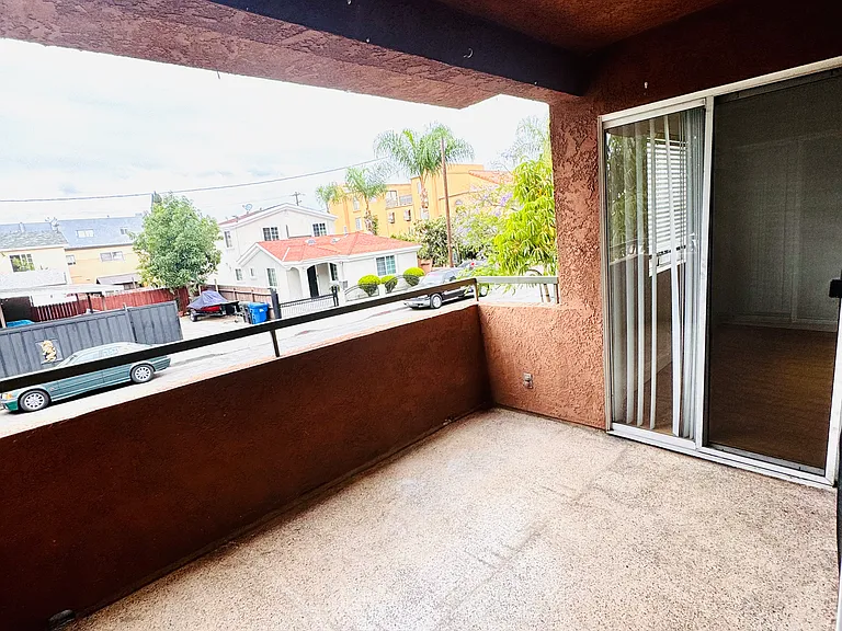 Expansive private balcony with three separate access points; one from each bedroom and one from the living room, creating seamless indoor-outdoor living and plenty of natural light throughout the home.