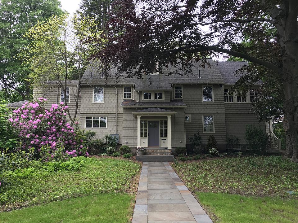 Street view of front entrance leading to foyer with private door to apartment.