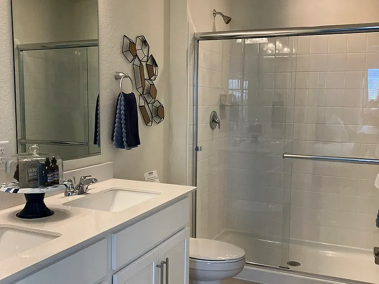Sample of same floor plan, different finishes, staged with furniture.