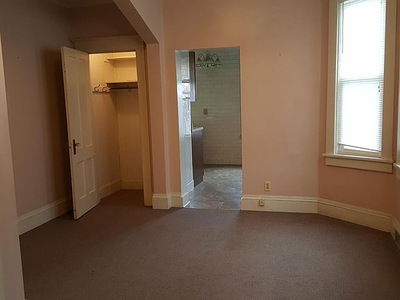 Living room w closet adjoining eat-in kitchen