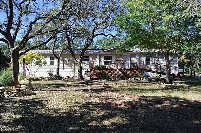 Very nice three bedroom two bath mobile home on private, wooded 2.67 acres