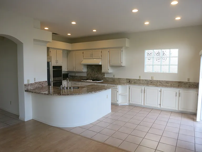 Large kitchen with stainless steel appliances and granite countertops